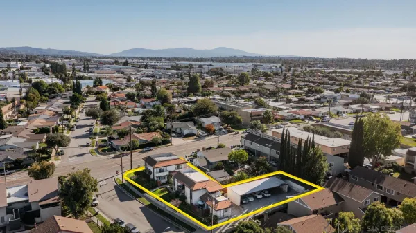 an aerial view of a house with a city view