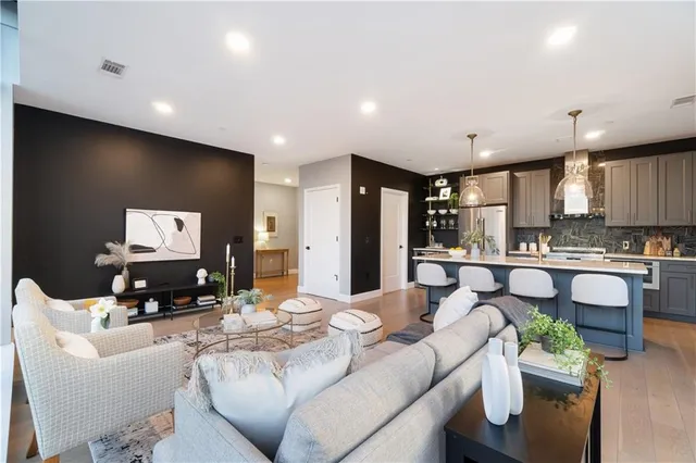 a living room with furniture and a large window