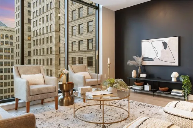 a kitchen with stainless steel appliances kitchen island granite countertop a refrigerator a sink and a stove