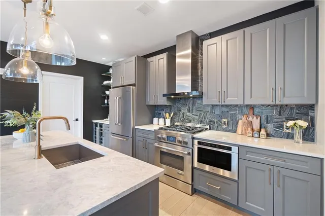 a kitchen with a stove and a sink