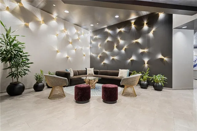 a view of a room with wooden floor and entryway