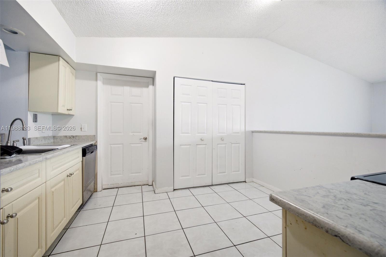 841 Southwest 55th Avenue Margate, FL 33068 - Photo 9 of 26 a kitchen with a sink and cabinets
