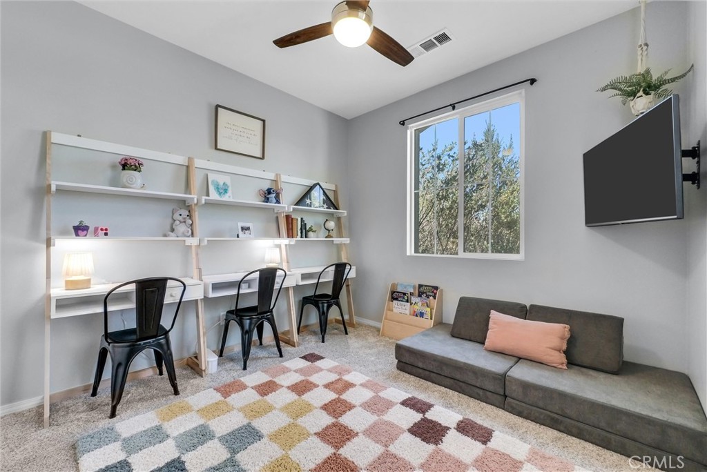 37656 Needlegrass Road Murrieta, CA 92563 - Photo 12 of 29 The downstairs bedroom is large, bright and private.