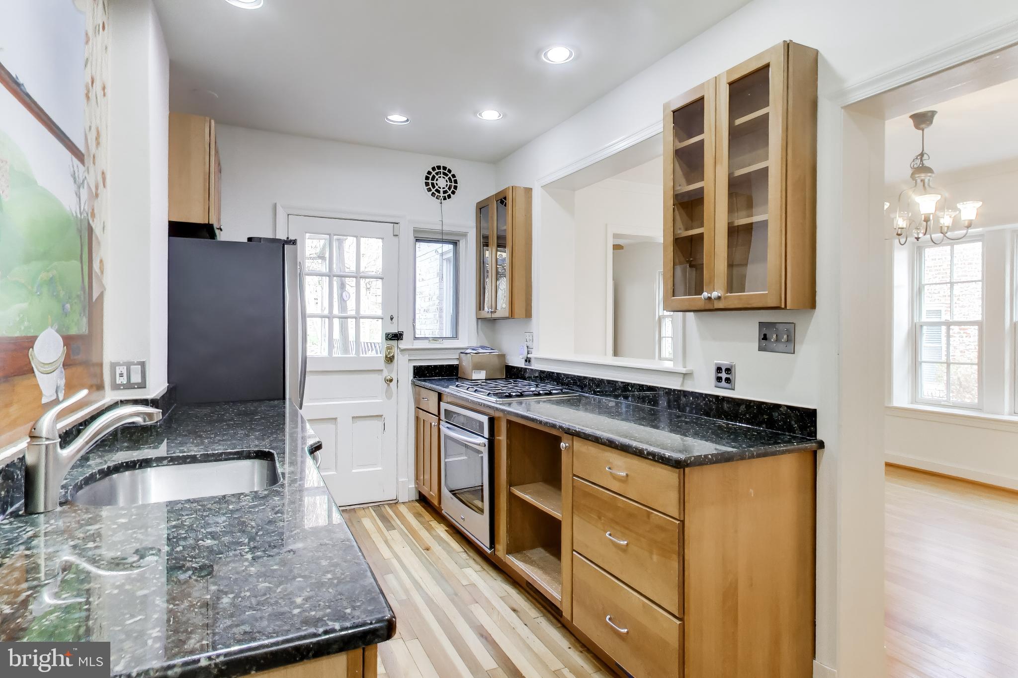 5138 Nebraska Avenue Northwest Washington, DC 20008 - Photo 2 of 39 a kitchen with stainless steel appliances granite countertop a stove a sink and a microwave
