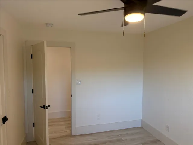 a view of a bathroom with wooden floor