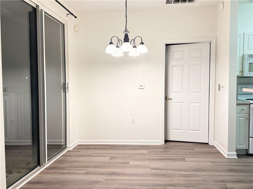 715 Stockton Ridge Cranberry Township, PA 16066 - Photo 7 of 27 a view of an empty room with wooden floor