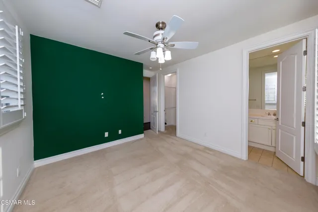 a view of an empty room with a bathroom