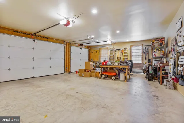 a view of a room with gym equipment and a large window
