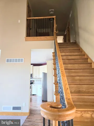 a view of a patio with table and chairs and potted plants