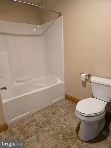 a view of a chairs and table in the patio