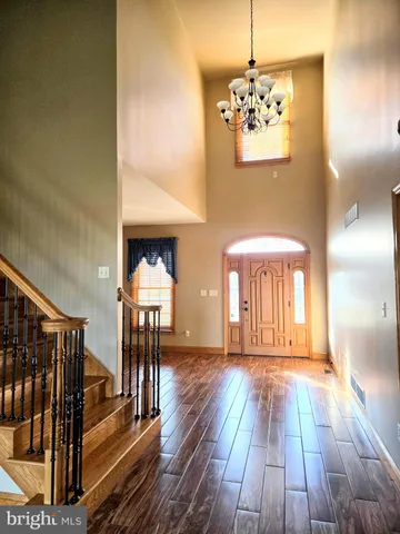 a view of empty room with stairs