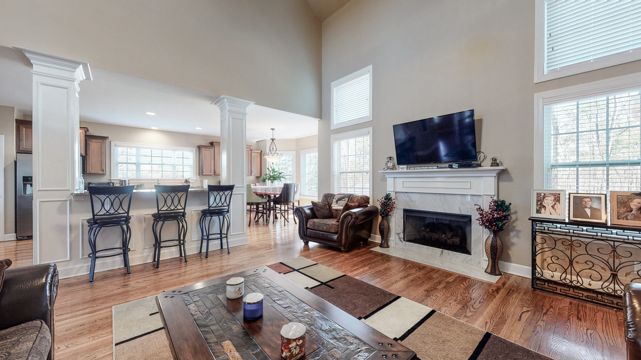 6137 Stags Leap Way Franklin, TN 37064 - Photo 11 of 27 a living room with furniture fireplace and flat screen tv