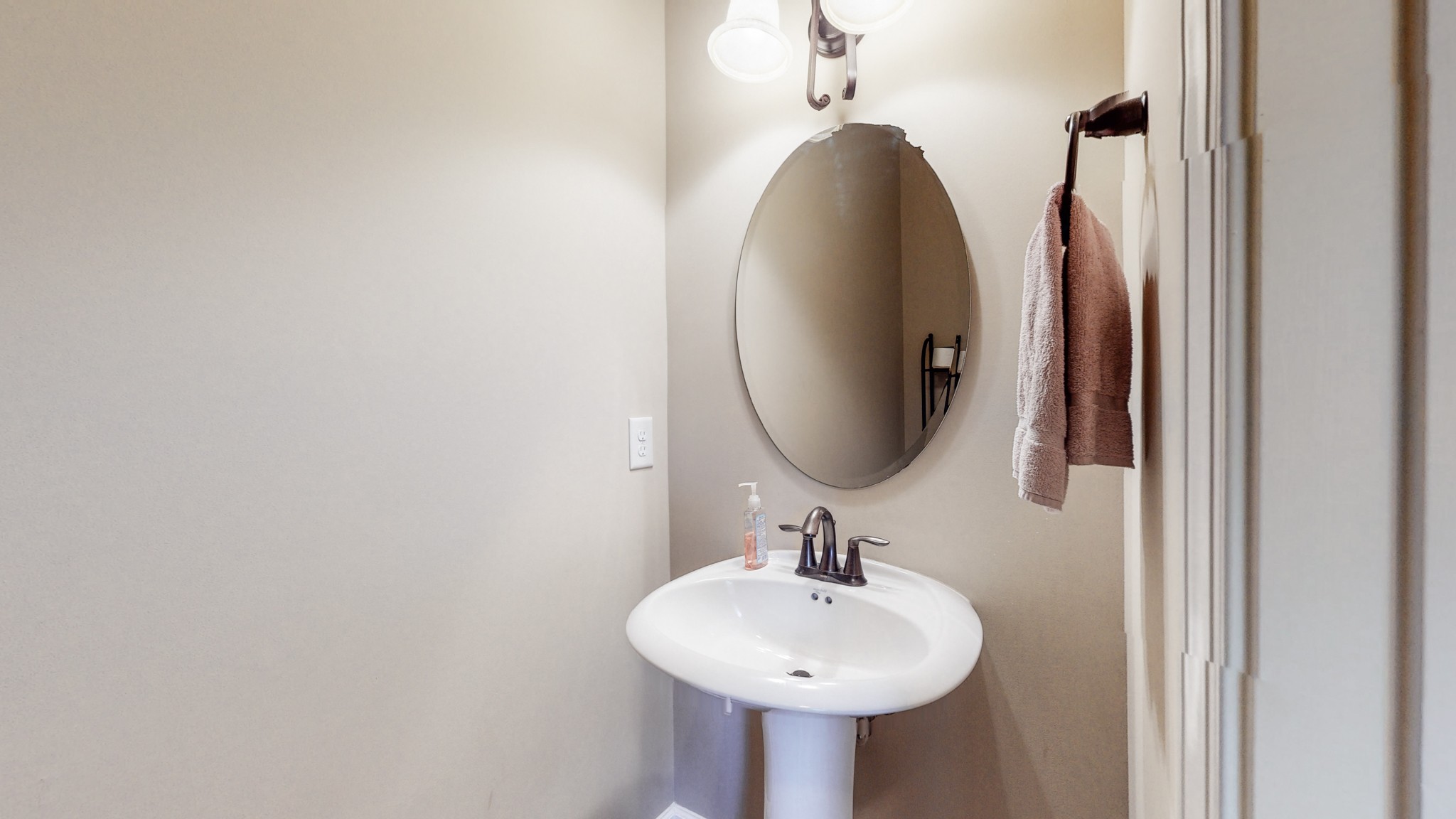 6137 Stags Leap Way Franklin, TN 37064 - Photo 14 of 27 a bathroom with a sink and a mirror
