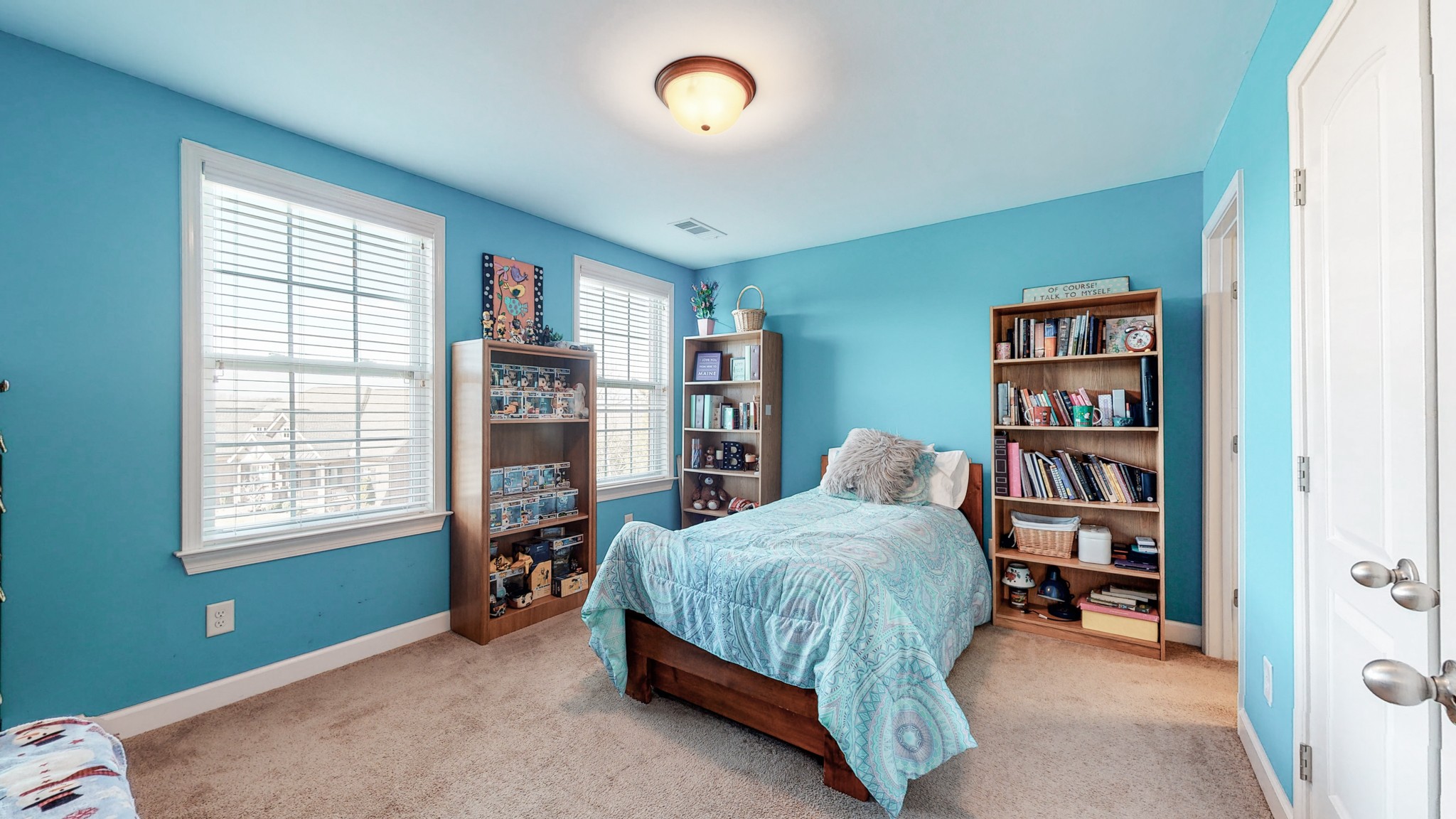 6137 Stags Leap Way Franklin, TN 37064 - Photo 18 of 27 a bedroom with a bed and a book shelf