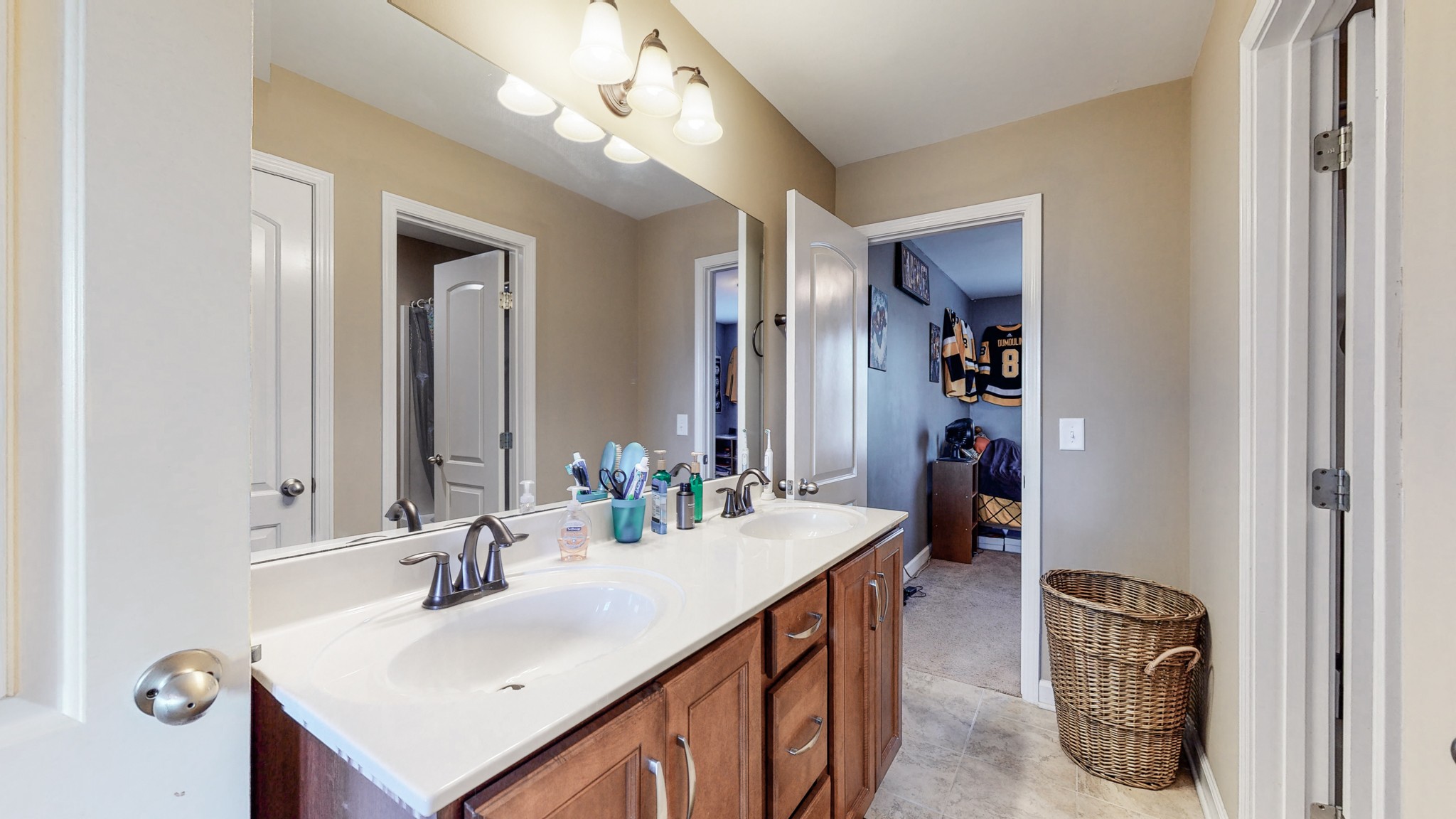 6137 Stags Leap Way Franklin, TN 37064 - Photo 19 of 27 a bathroom with a sink a light fixture and a mirror