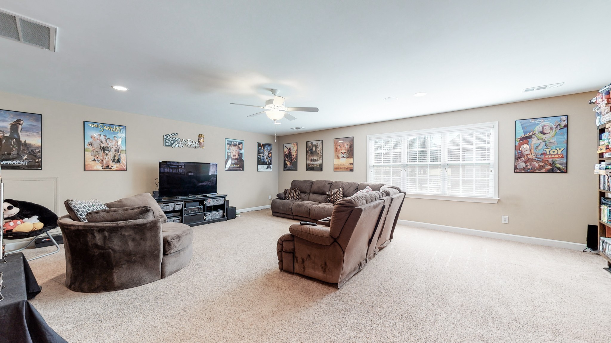6137 Stags Leap Way Franklin, TN 37064 - Photo 22 of 27 a living room with furniture a flat screen tv and a window