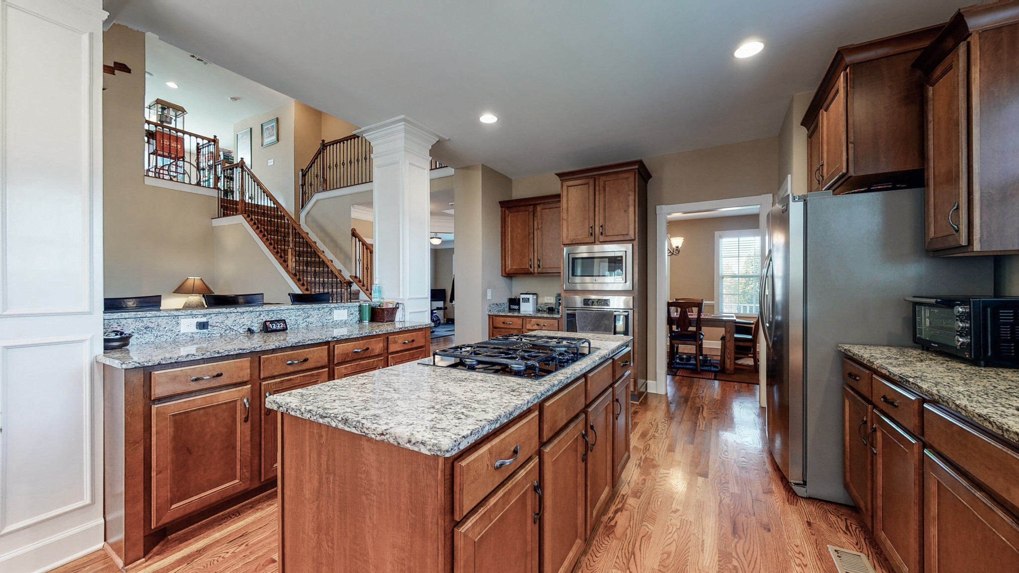6137 Stags Leap Way Franklin, TN 37064 - Photo 4 of 27 a kitchen with stainless steel appliances granite countertop a stove and a sink