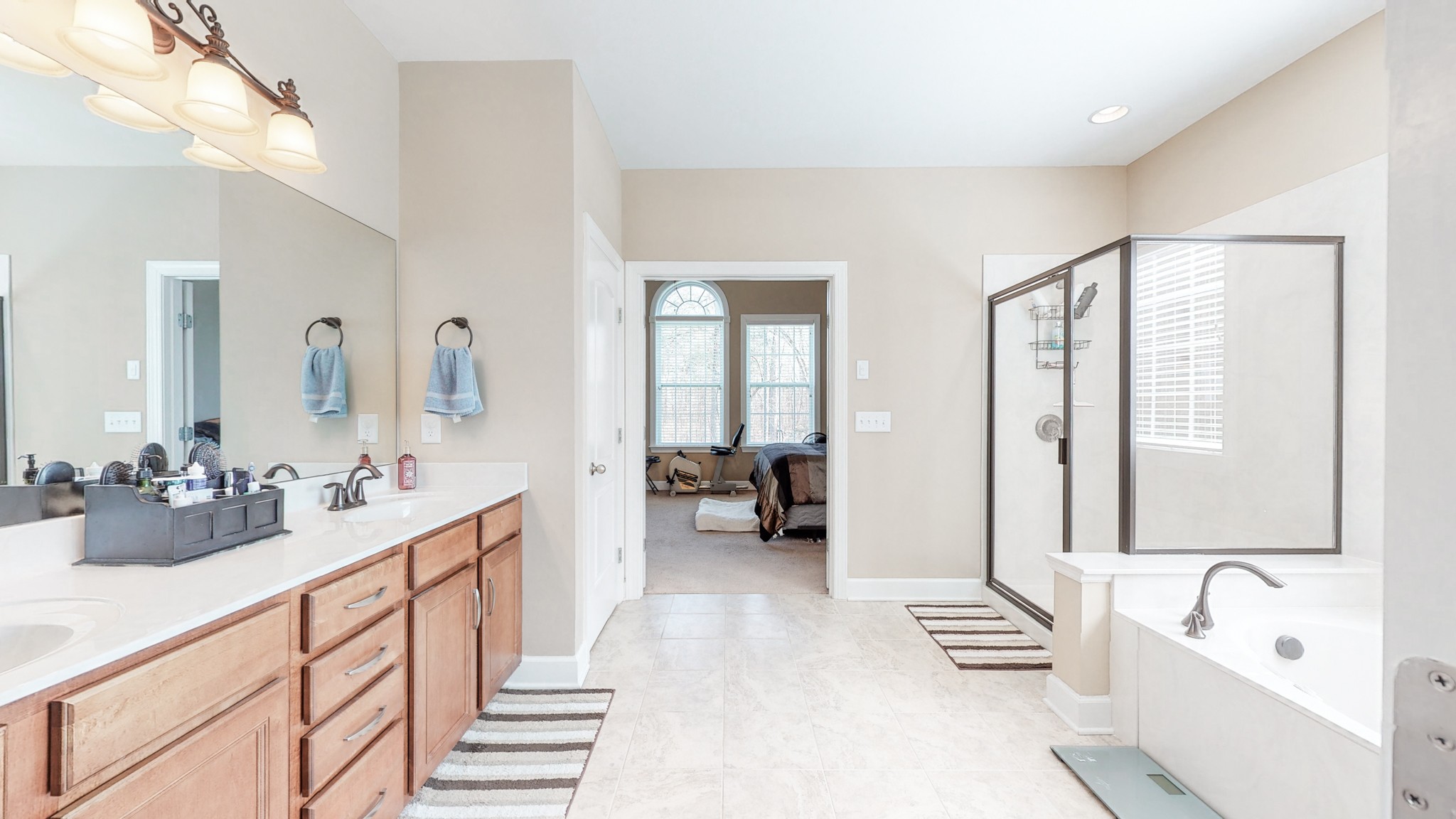 6137 Stags Leap Way Franklin, TN 37064 - Photo 9 of 27 a en suite spacious bathroom with double sink and a large mirror