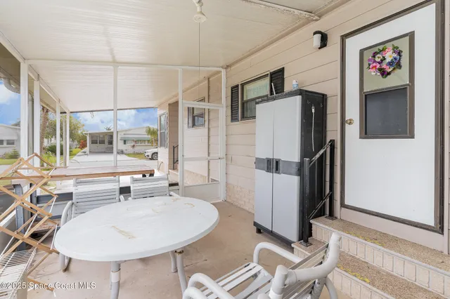 a room with furniture and a chandelier