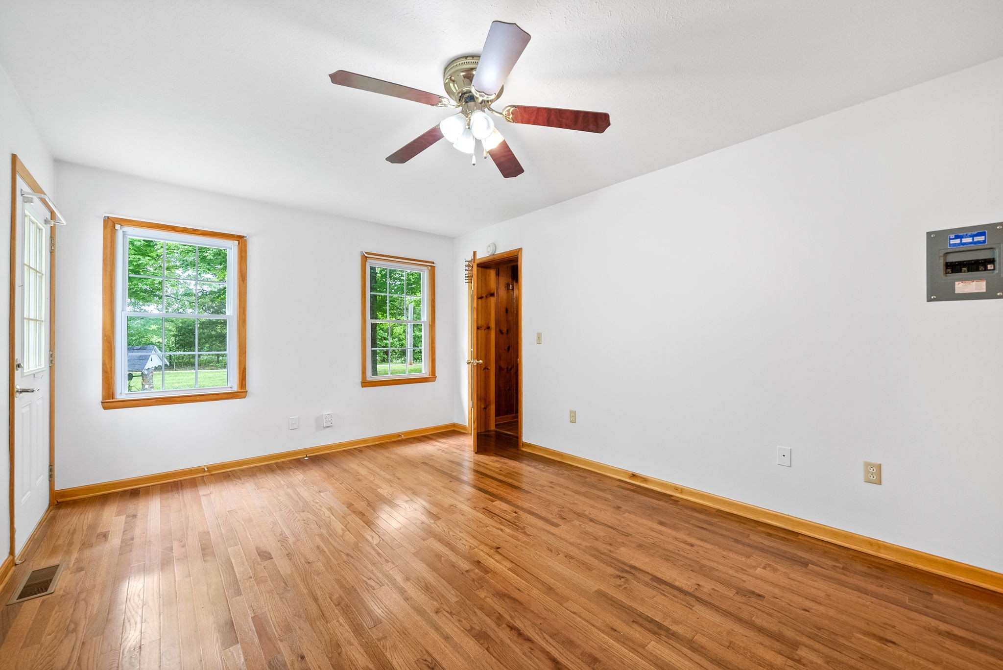 4551 Marion Road Cunningham, TN 37052 - Photo 20 of 32 a view of an empty room with wooden floor and a window