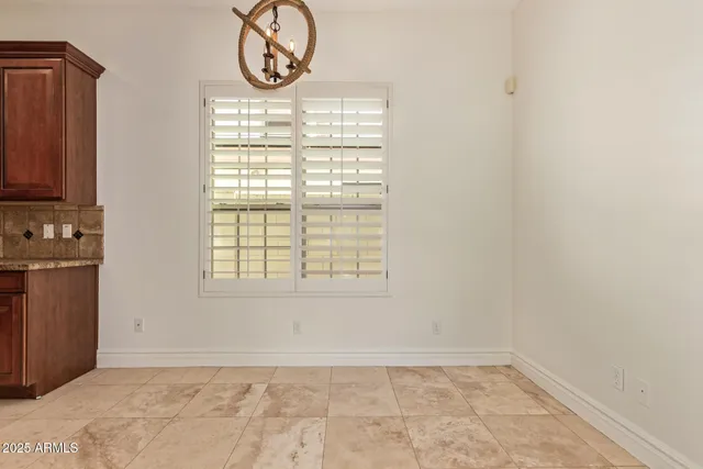 a view of a room with window and bathroom