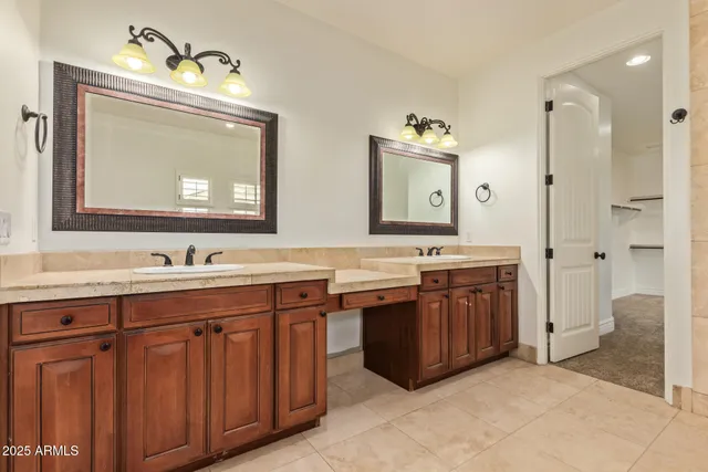 a bathroom with a double vanity sink mirror and double