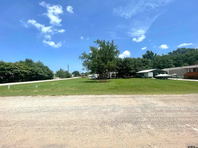 a view of a golf course with a lake