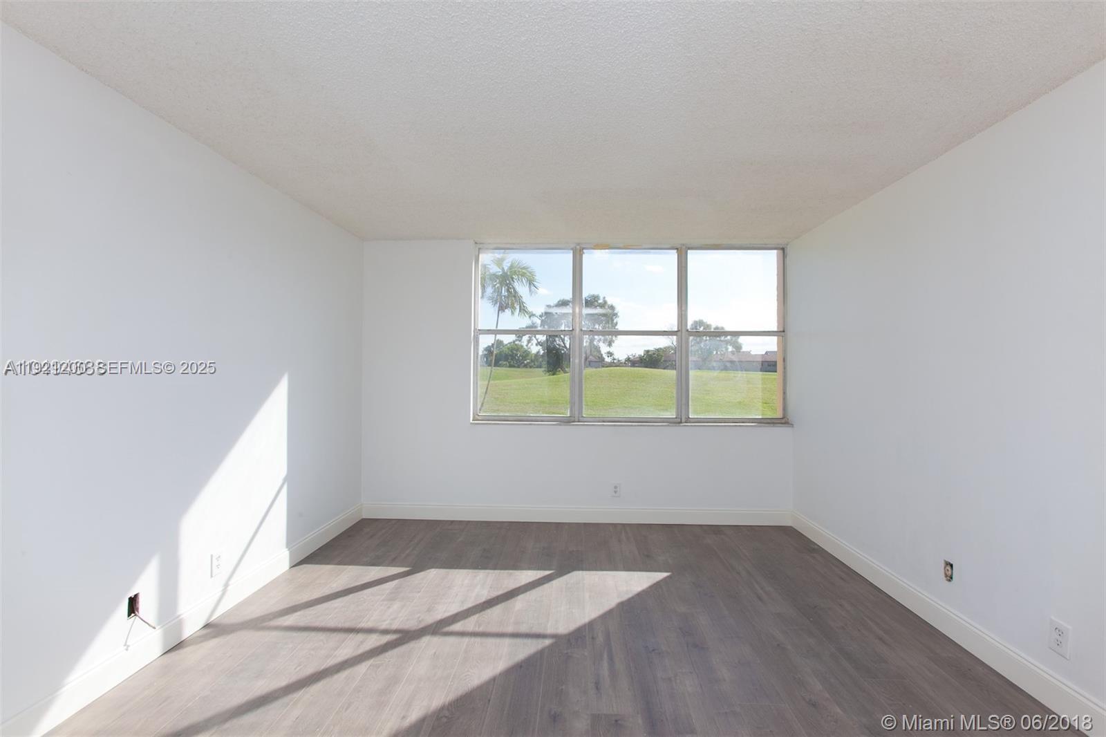 3821 Environ Boulevard, Unit 107 Lauderhill, FL 33319 - Photo 9 of 19 a view of empty room with window