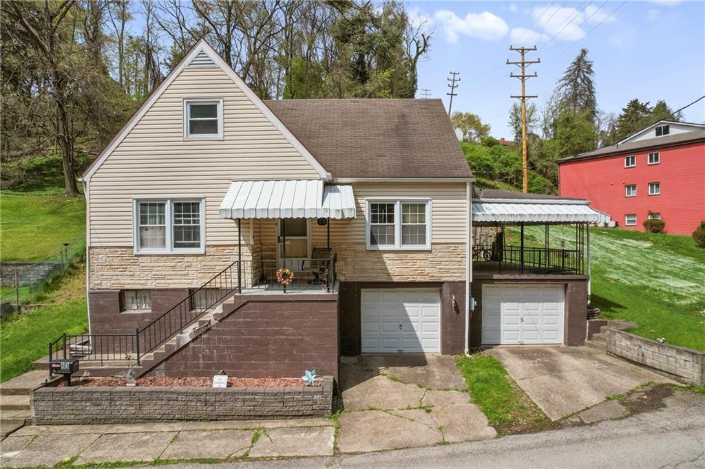 a front view of a house with yard