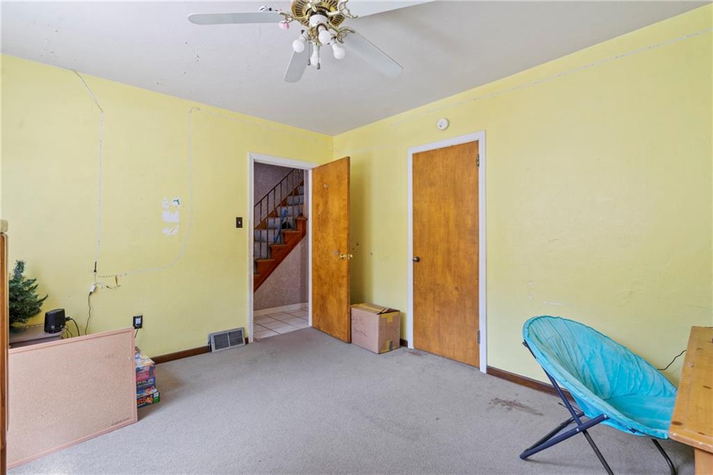 53 Lawrence Street Pittsburgh, PA 15209 - Photo 13 of 36 a view of a room with furniture and chandelier fan