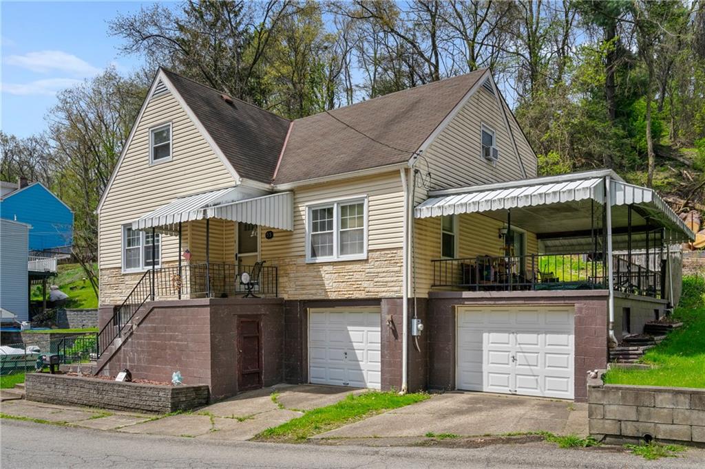 53 Lawrence Street Pittsburgh, PA 15209 - Photo 2 of 36 a front view of a house with garden
