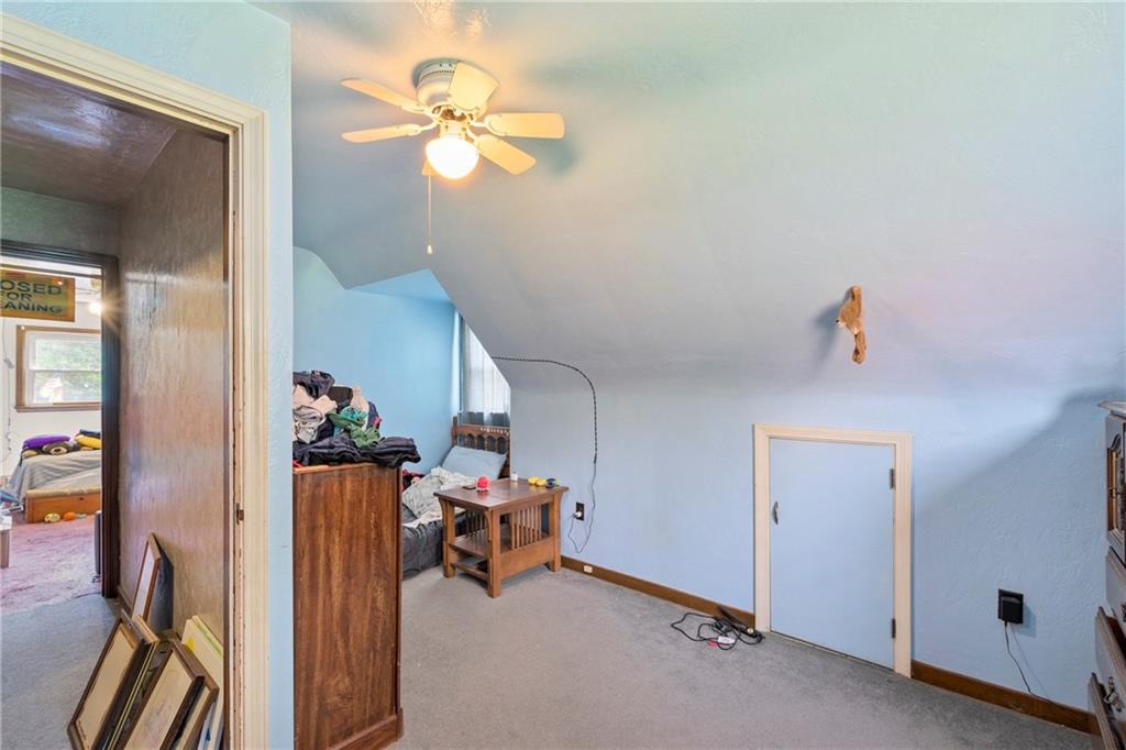 53 Lawrence Street Pittsburgh, PA 15209 - Photo 24 of 36 a view of a livingroom with furniture and a ceiling fan