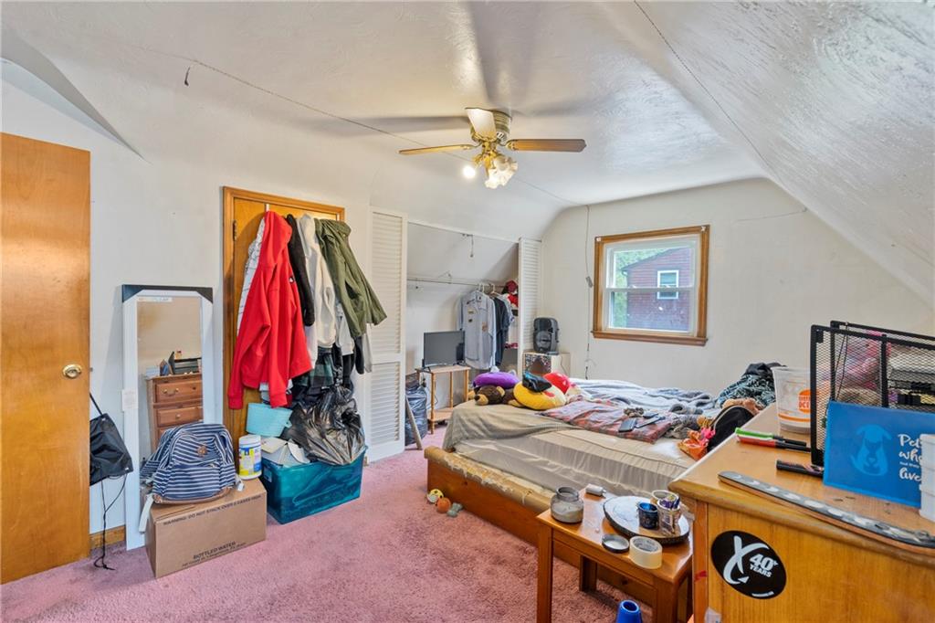 53 Lawrence Street Pittsburgh, PA 15209 - Photo 26 of 36 a bed room with a bed and a wooden floor