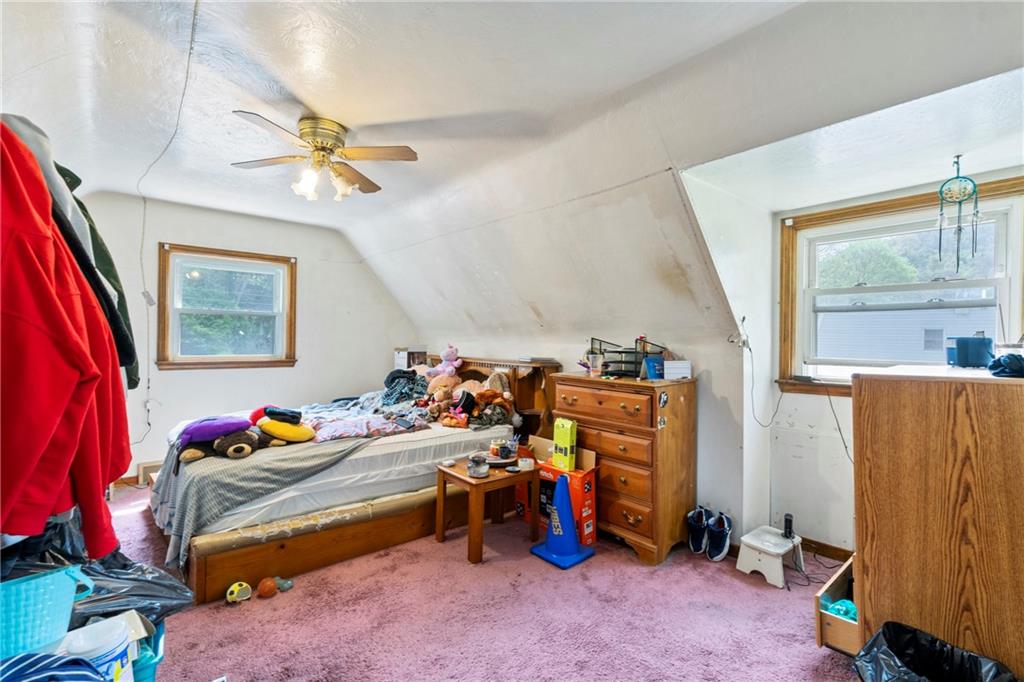 53 Lawrence Street Pittsburgh, PA 15209 - Photo 27 of 36 a bed room with a bed and a window