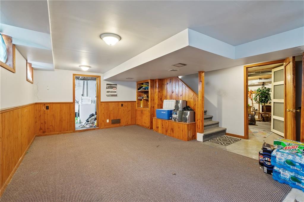 53 Lawrence Street Pittsburgh, PA 15209 - Photo 29 of 36 a view of a room with gym equipment and a large window