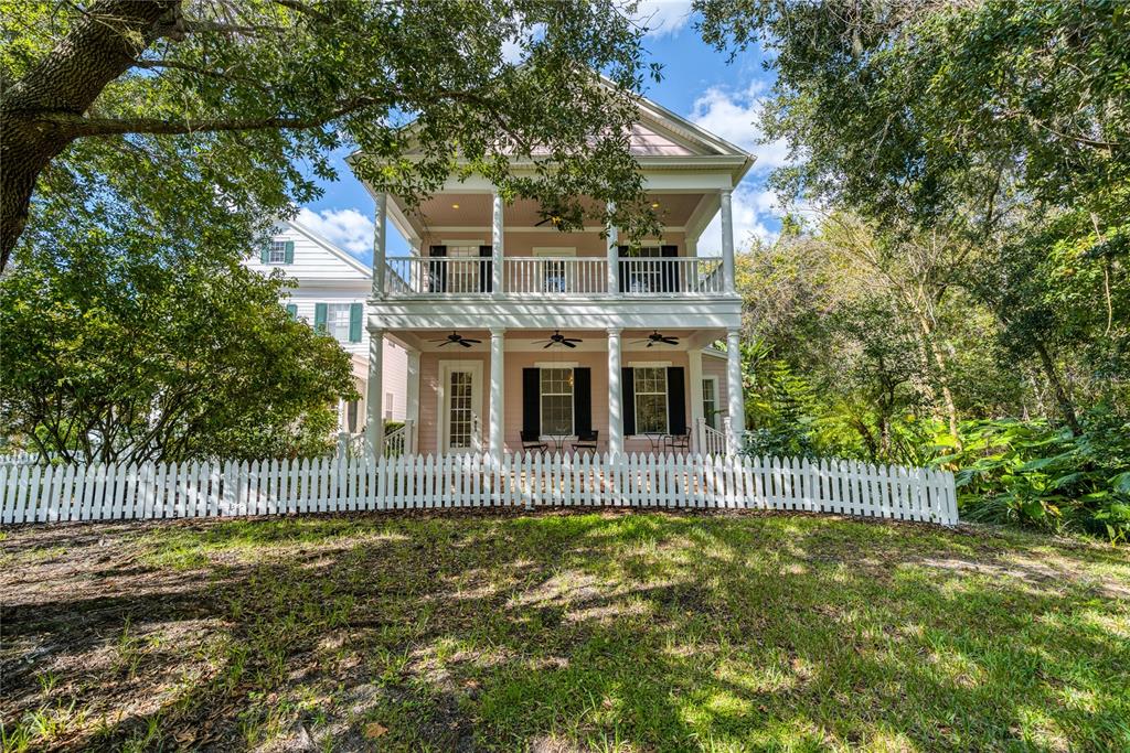 815 Lake Evalyn Drive Celebration, FL 34747 - Photo 1 of 1 a front view of a house with a garden and plants