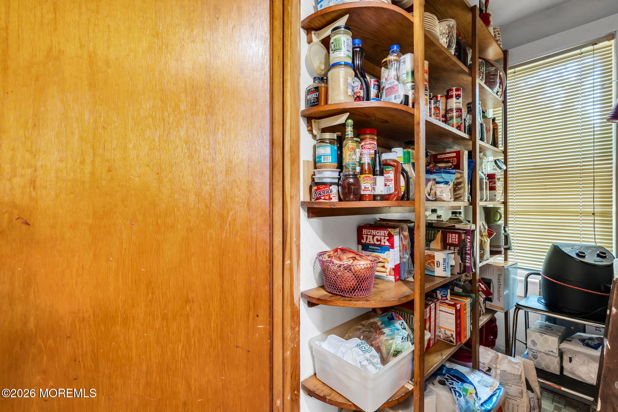 24 Foster Street Middletown, NJ 07701 - Photo 14 of 23 a view of a room with shelves