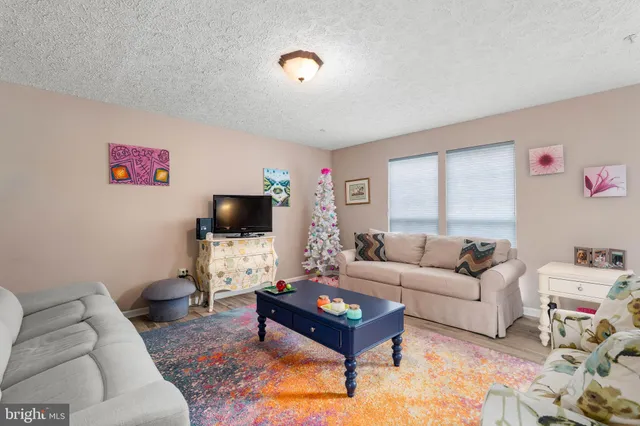 a kitchen with stainless steel appliances a stove a sink and a refrigerator