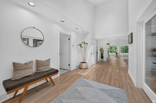 1979 Cave Hollow Way Bountiful, UT 84010 - Photo 4 of 59 Entryway featuring vaulted ceilings, recessed lighting, wood-finish flooring, and crisp white walls