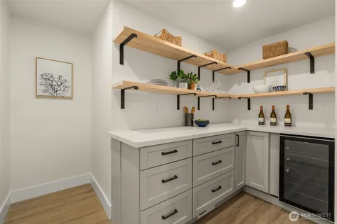 a kitchen with cabinets appliances and a counter space