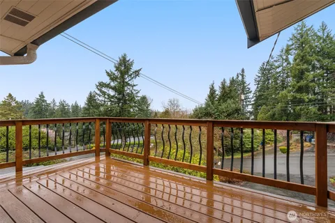 a view of balcony with wooden floor
