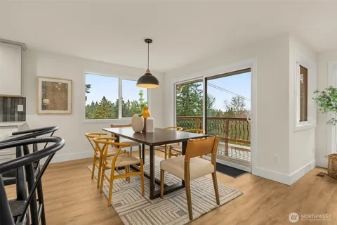 a view of a dining room with furniture window and outside view