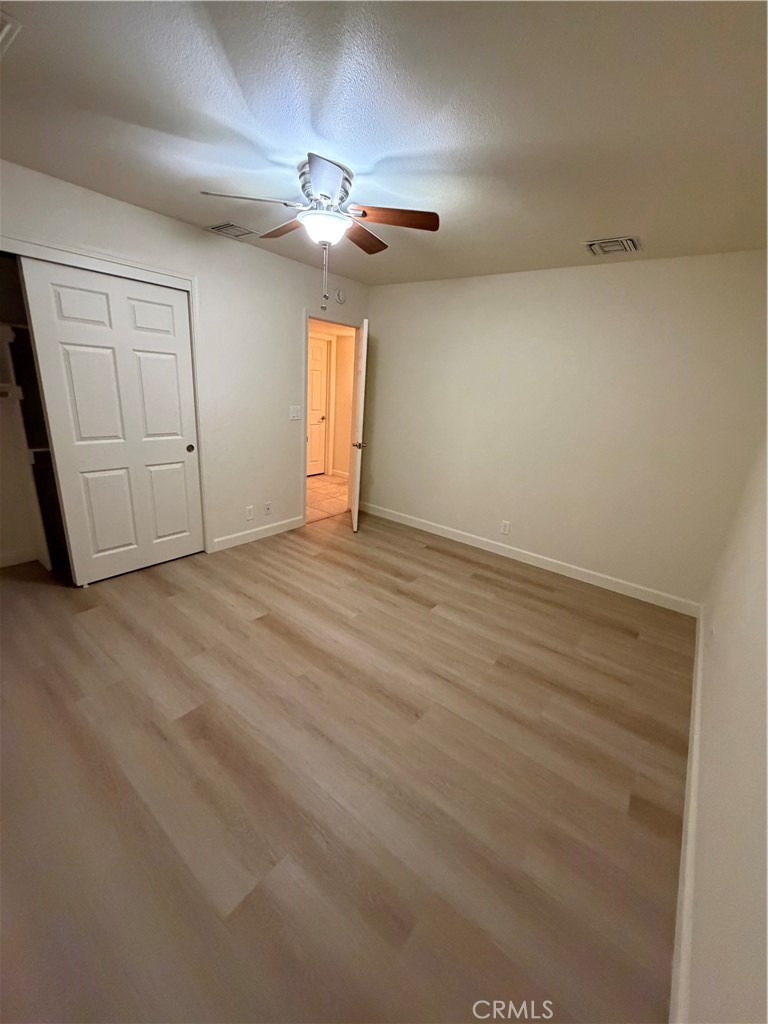209 Kimberly Lane Ridgecrest, CA 93555 - Photo 57 of 62 a view of an empty room with a chandelier fan