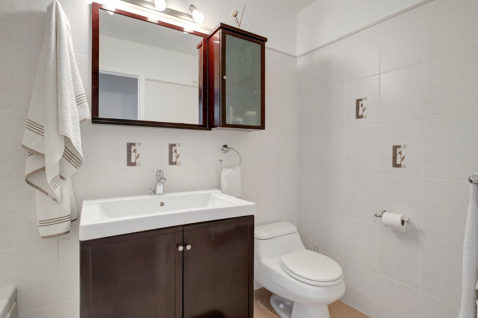 950 East Old Willow Road, Unit 102 Prospect Heights, IL 60070 - Photo 11 of 27 a bathroom with a toilet sink and mirror