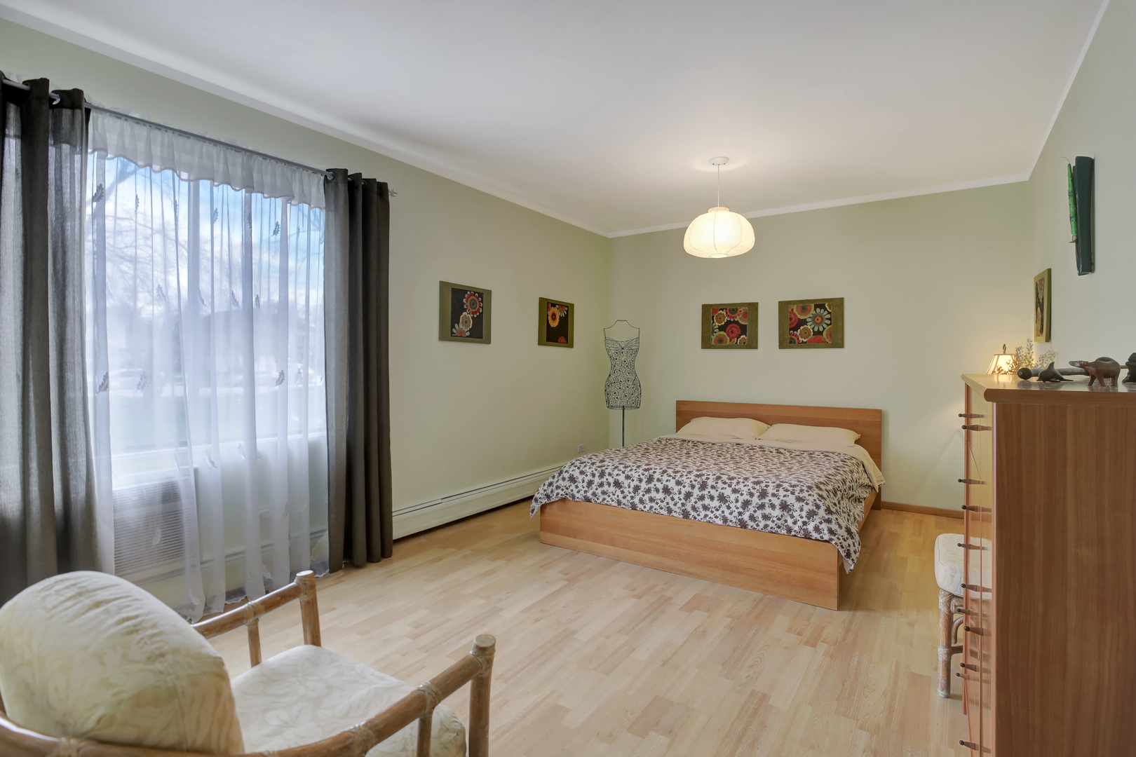 950 East Old Willow Road, Unit 102 Prospect Heights, IL 60070 - Photo 12 of 27 a spacious bedroom with a bed and a chandelier