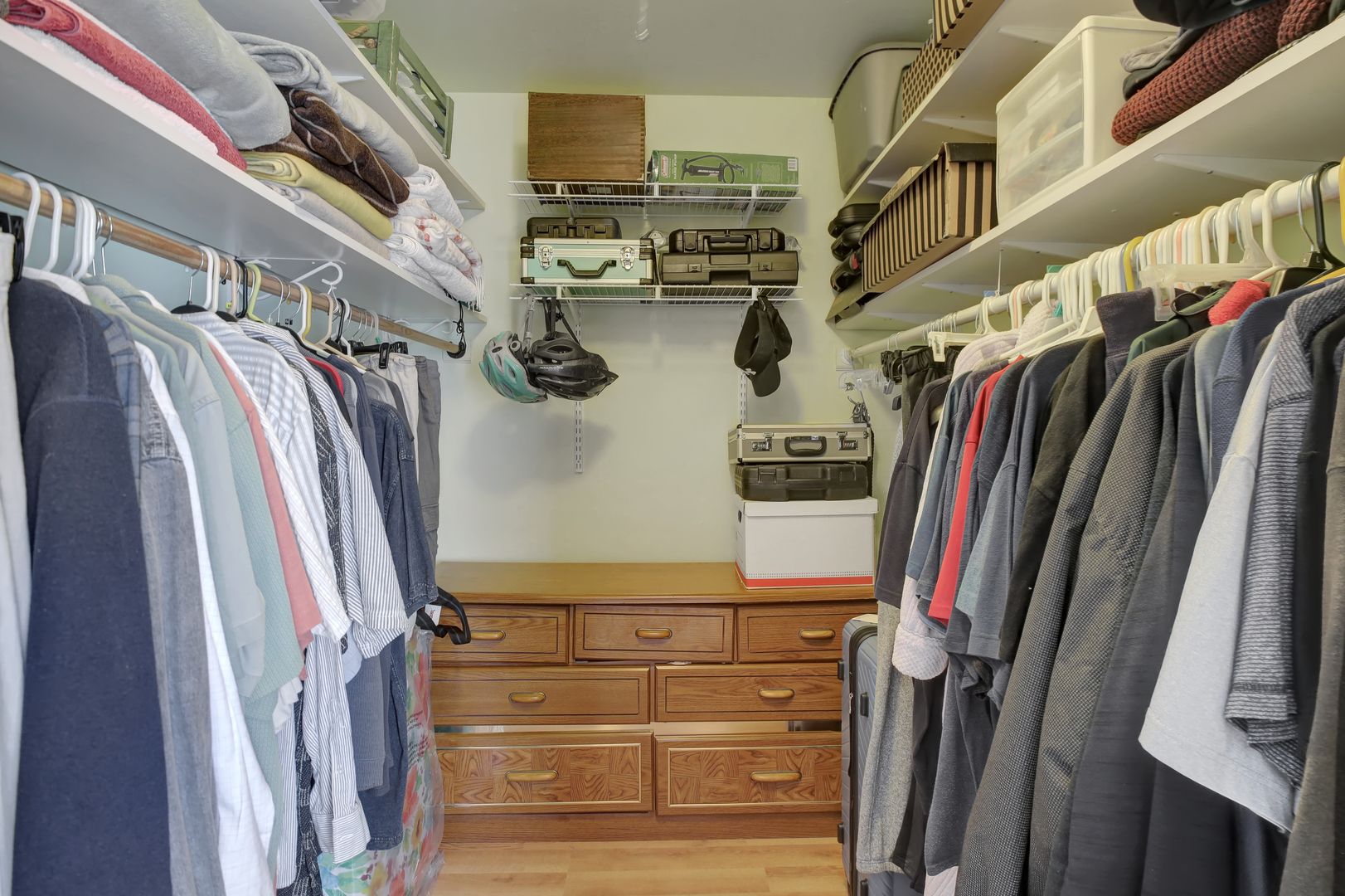950 East Old Willow Road, Unit 102 Prospect Heights, IL 60070 - Photo 15 of 27 a view of walk in closet with clothes and shoes
