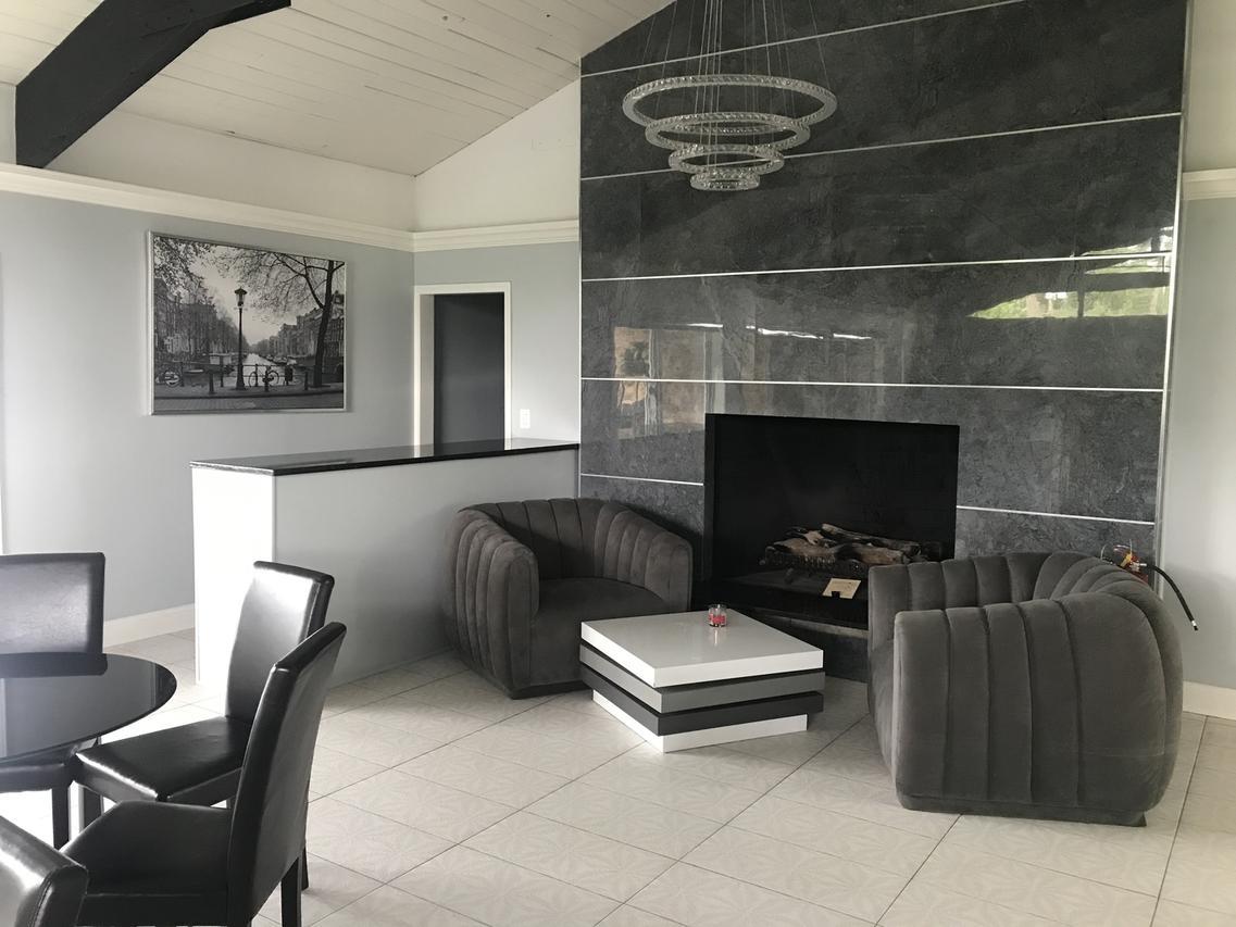 950 East Old Willow Road, Unit 102 Prospect Heights, IL 60070 - Photo 24 of 27 a living room with furniture and a fireplace