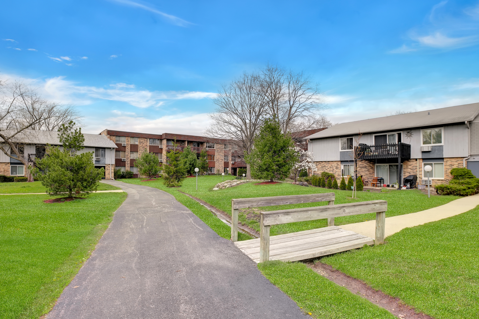 950 East Old Willow Road, Unit 102 Prospect Heights, IL 60070 - Photo 25 of 27 a front view of a house with a yard table and chairs