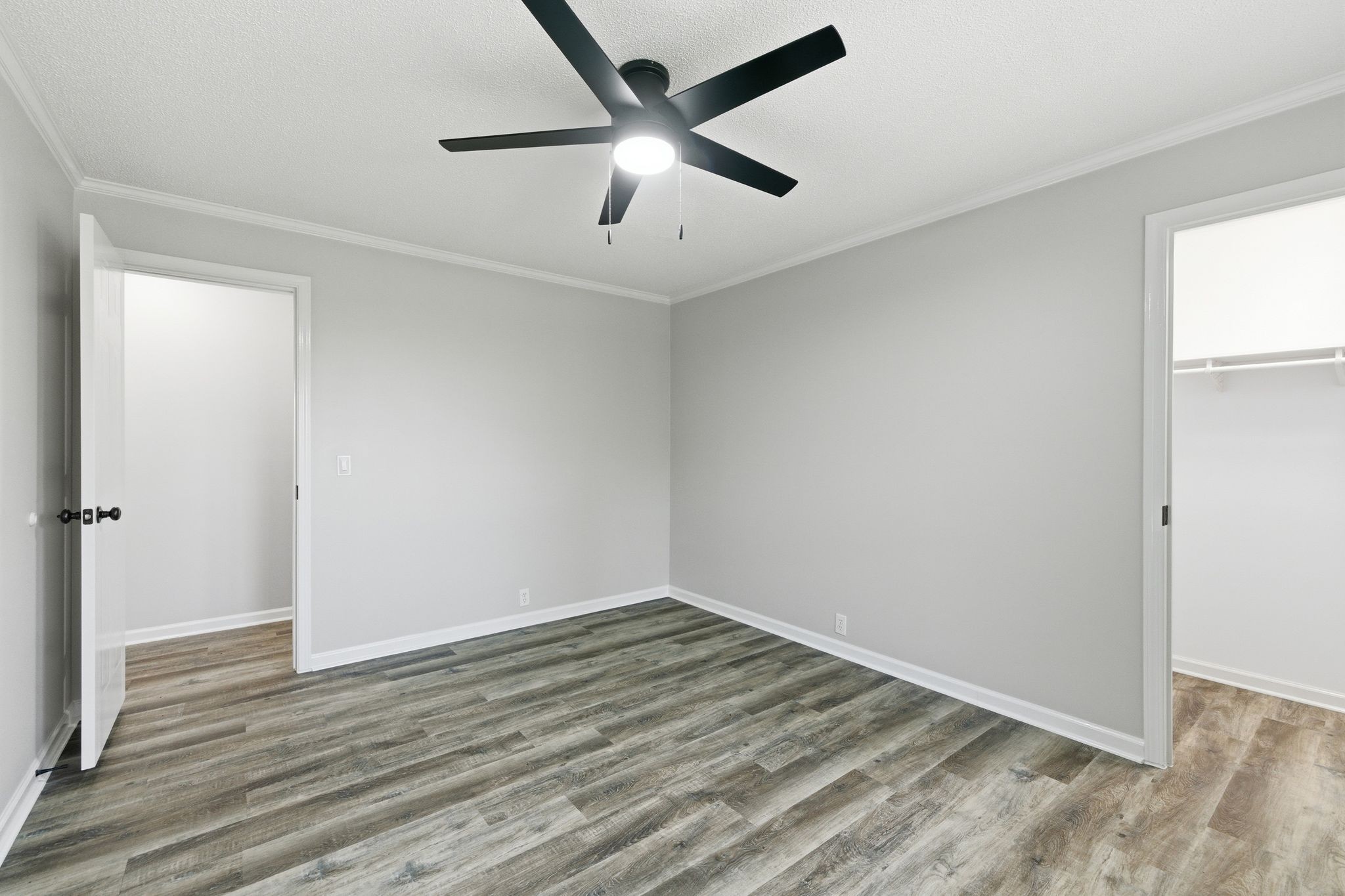 1021 B Jordan Road Lascassas, TN 37085 - Photo 33 of 58 an empty room with wooden floor and a ceiling fan