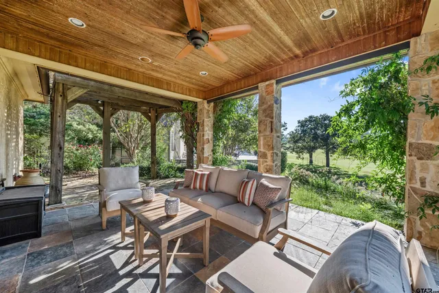 a outdoor living space with furniture and garden view